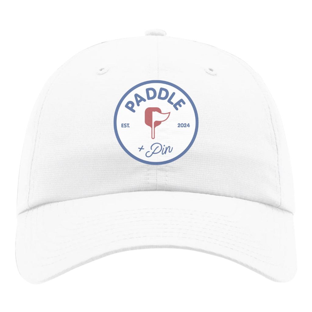 White cap with 'Paddle + Pin' logo on a white background
